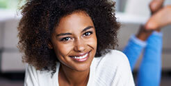 Lady in living room smiling